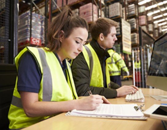 Two people working in a warehouse
